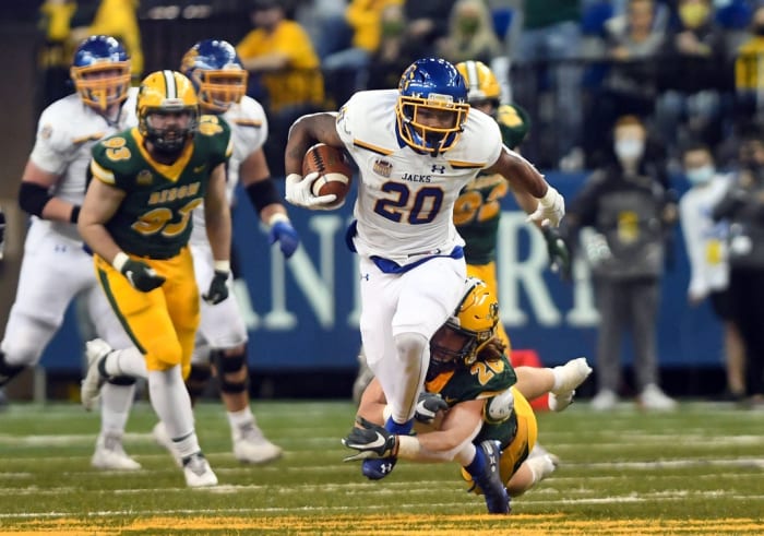 South Dakota State's Pierre Strong, Jr. slips out of the grasp of North Dakota State's James Kaczor. Erin Bormett / Argus Leader via Imagn Content Services, LLC